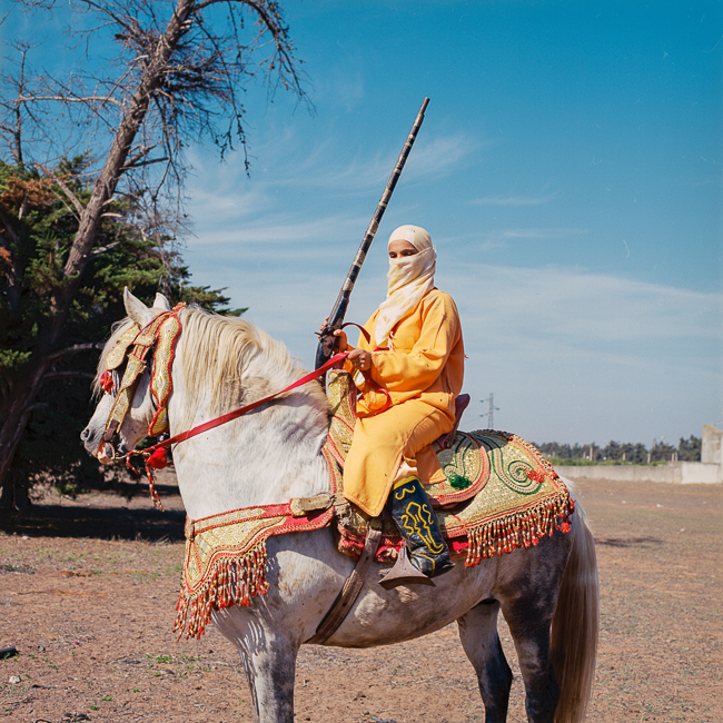 Bouchra rides her Arab-Barb horse at the head of the all-female Farisat Al Hawzia Tbourida troupe in Morocco.