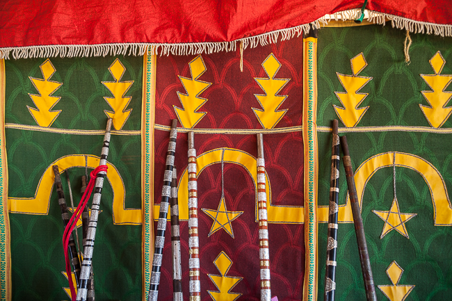 A Tbourida rider prepares a traditional rifle loaded with black powder before a performance in Morocco.